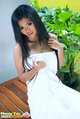 Meena yen sitting on bench long hair wearing towel