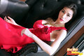 Mei mei reclining on chair in red dress